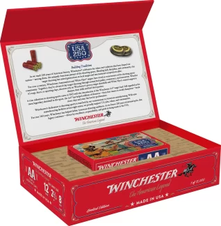 Red Winchester AA shotgun shells box opened to reveal a decorative inner tray and a booklet or certificate inside the lid, celebrating a USA 250 years theme.
