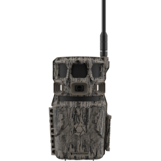 Camouflage trail camera with an external antenna, central lens, and Stealth Cam logo on the camouflaged body.