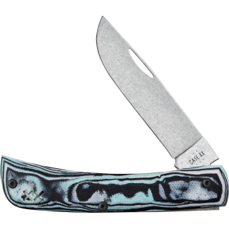 Close-up of a large metal knife blade angled diagonally over a turquoise skateboard deck with black grip trim beneath.