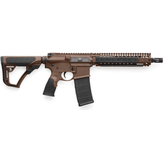 AR-style rifle with brown finish, collapsible stock, pistol grip, quad-rail handguard, and a detachable magazine visible from the side.