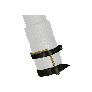 Close-up of a white camera lens with a black adjustable strap wrapped around its middle.