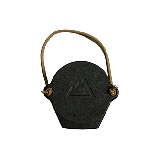 Black hexagonal pendant with a tan cord, featuring a minimalist mountain logo.