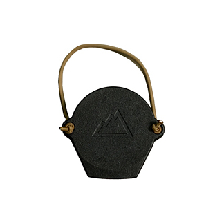 Black hexagonal tag with a brown leather strap and an embossed mountain logo in the center.