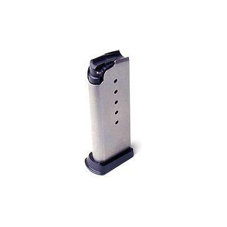 Metal pistol magazine with a dark base, standing upright; shows four witness holes indicating rounds.