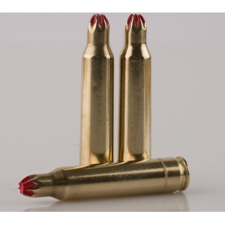 Three brass ammunition cartridges with red tips arranged upright, plus one lying horizontally on a light gray surface.