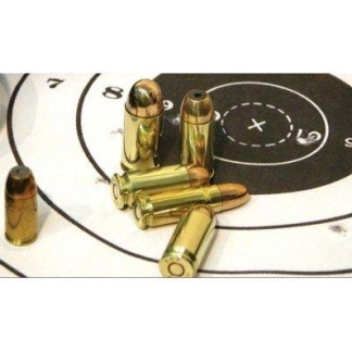 Brass spent bullet casings scattered on a black-and-white shooting target with concentric rings and a bullseye nearby.